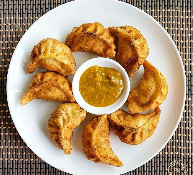 Pan-fried momos with achar