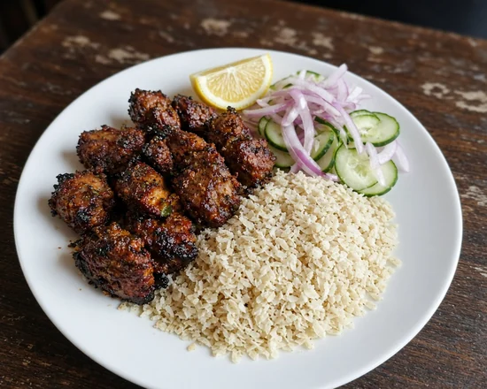 Sekuwa: sekuwa grilled meat with beaten rice, onion and cucumber