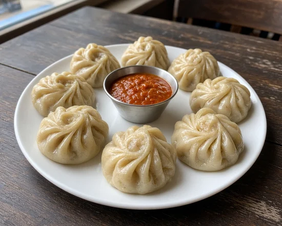 Steam Momo: steamed momos with tomato achar